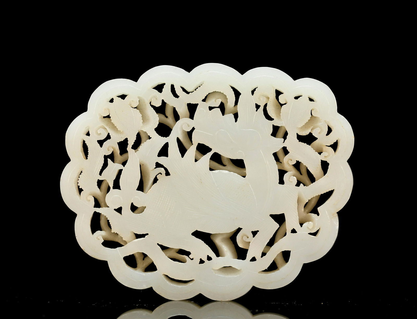 A Supremely asethetic White Jade 'Kylin' Pendant (1 of 4)