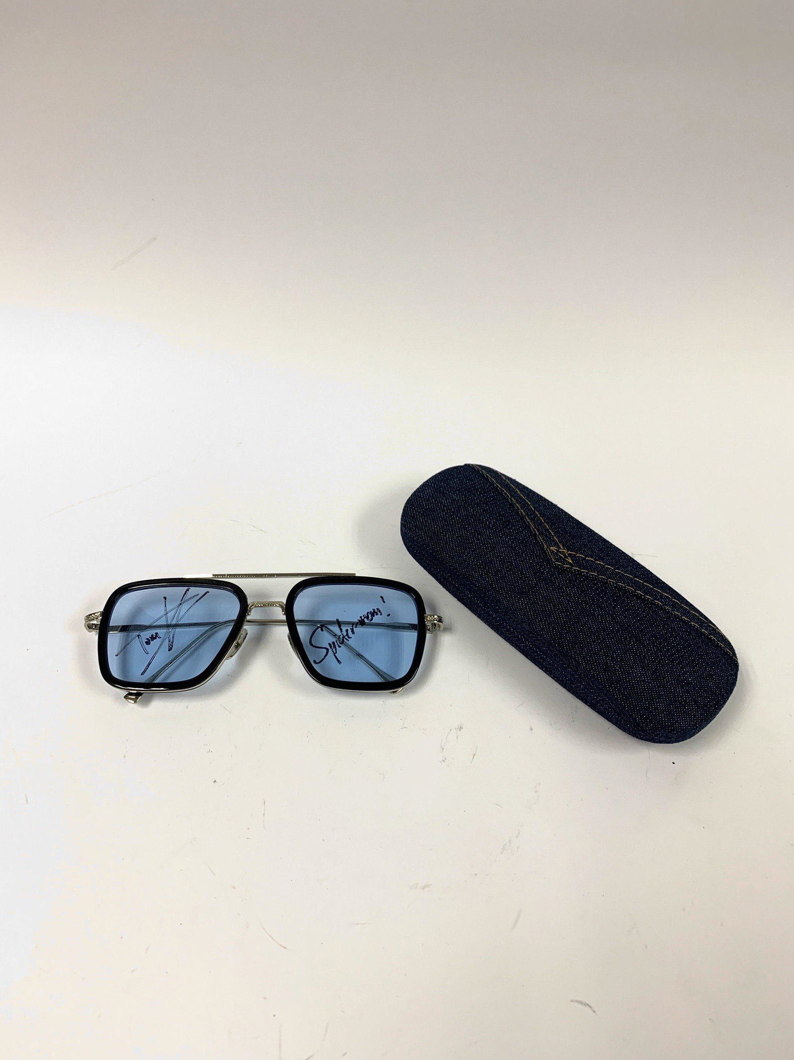 Autograph Signed Iron Man Sunglasses: Autographed by:Tom HollandItem is in Excellent Condition and Certified. Please read our terms before placing bids.