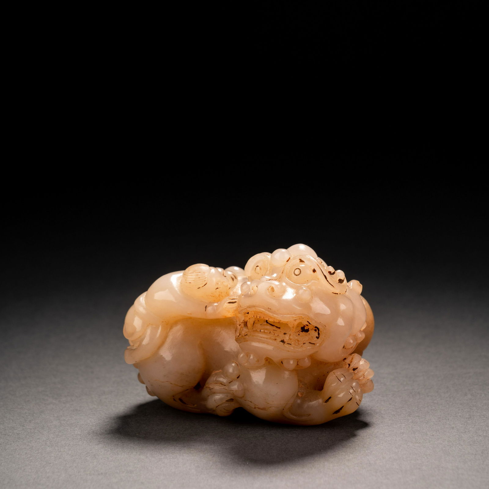 Qing Dynasty Hetian jade figure training lion ornament (1 of 7)