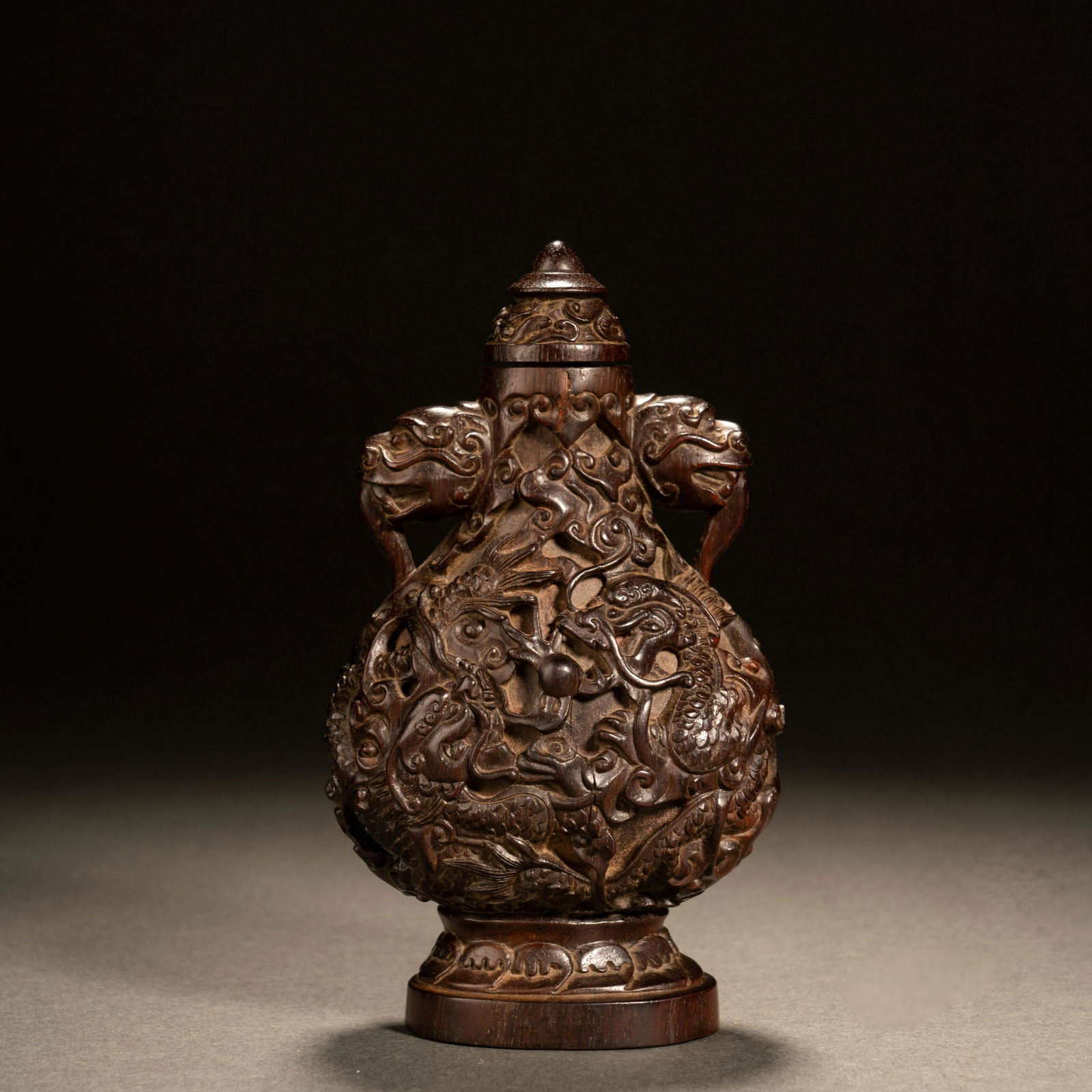 Qing Dynasty red sandalwood dragon pattern snuff bottle (1 of 8)