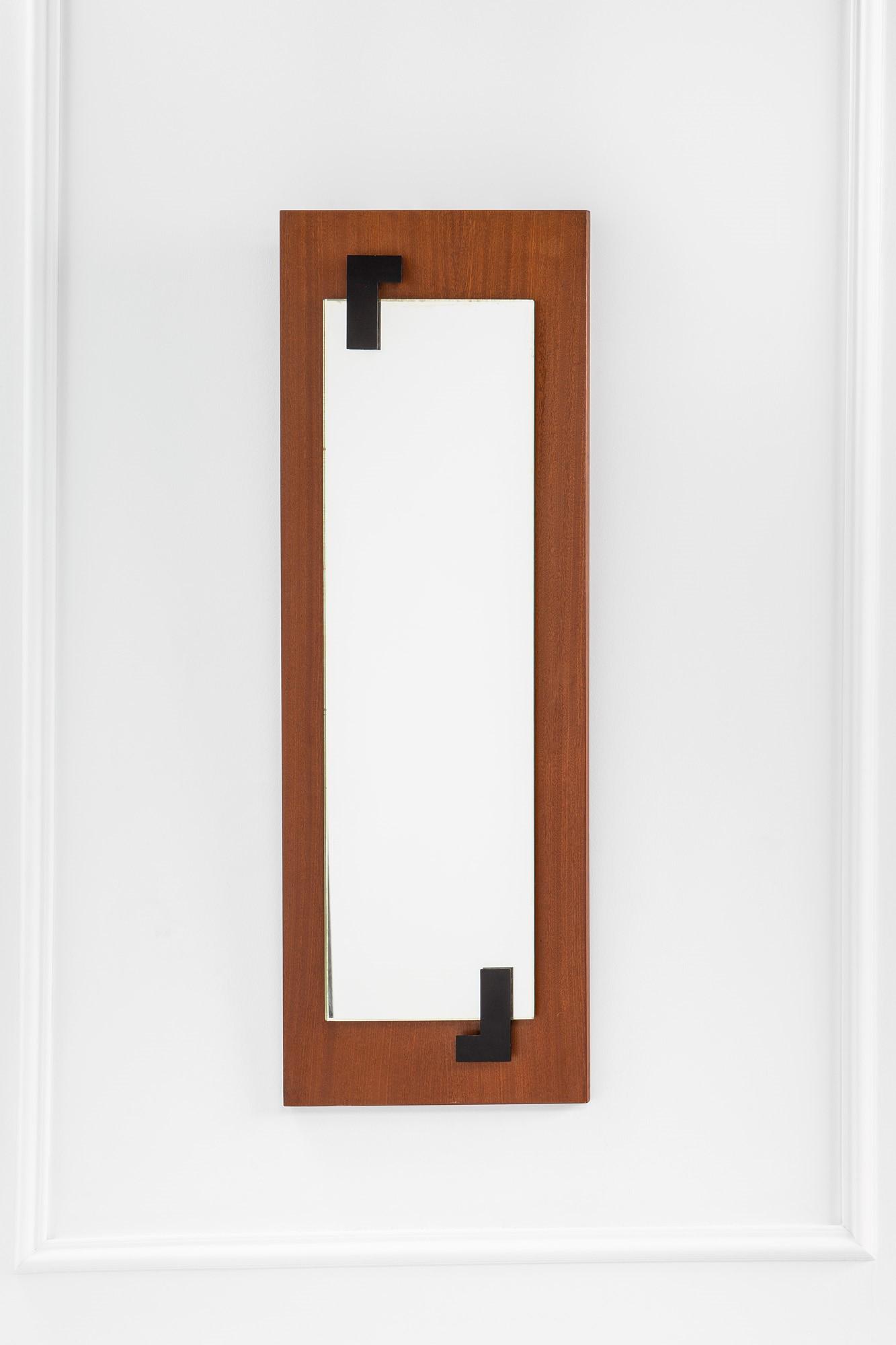 Fontana Arte, Specchiera: Specchiera Legno di teak, metallo verniciato, vetro specchiato. Prod. Fontana Arte, 1959 ca. Etichetta del produttore. cm 101x35 Literature: Domus, n. 361, dicembre 1959, pagina rassegna di oggetti re