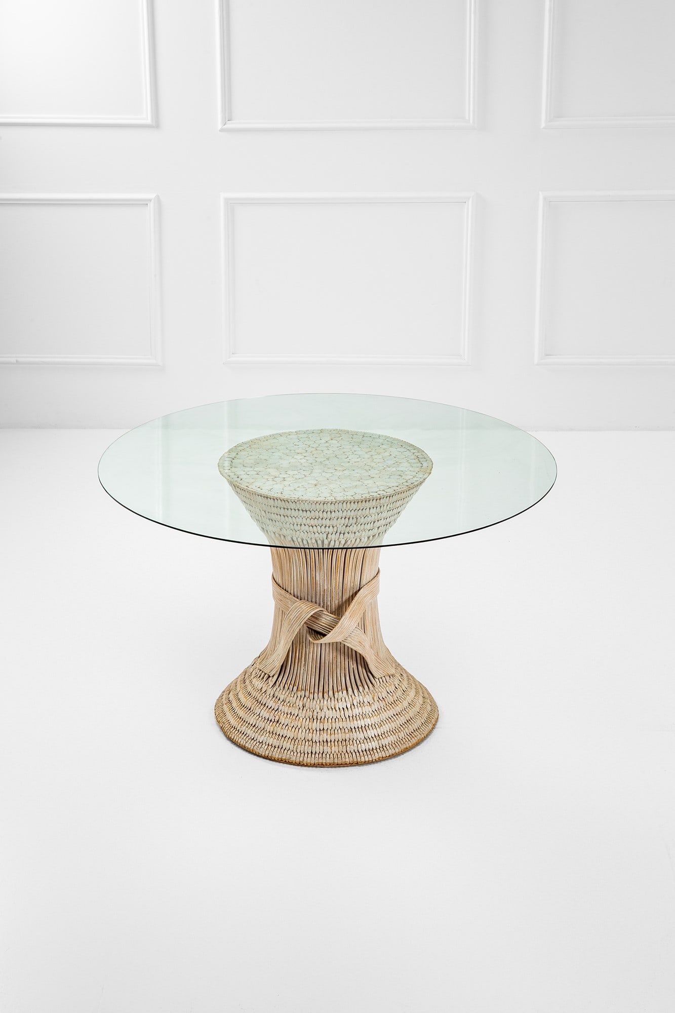 Marzio Cecchi (attr.). Tavolo: TavoloCanna d'India verniciata, cristallo.Prod. Most, 1960 ca.h cm 73, diam. cm 121