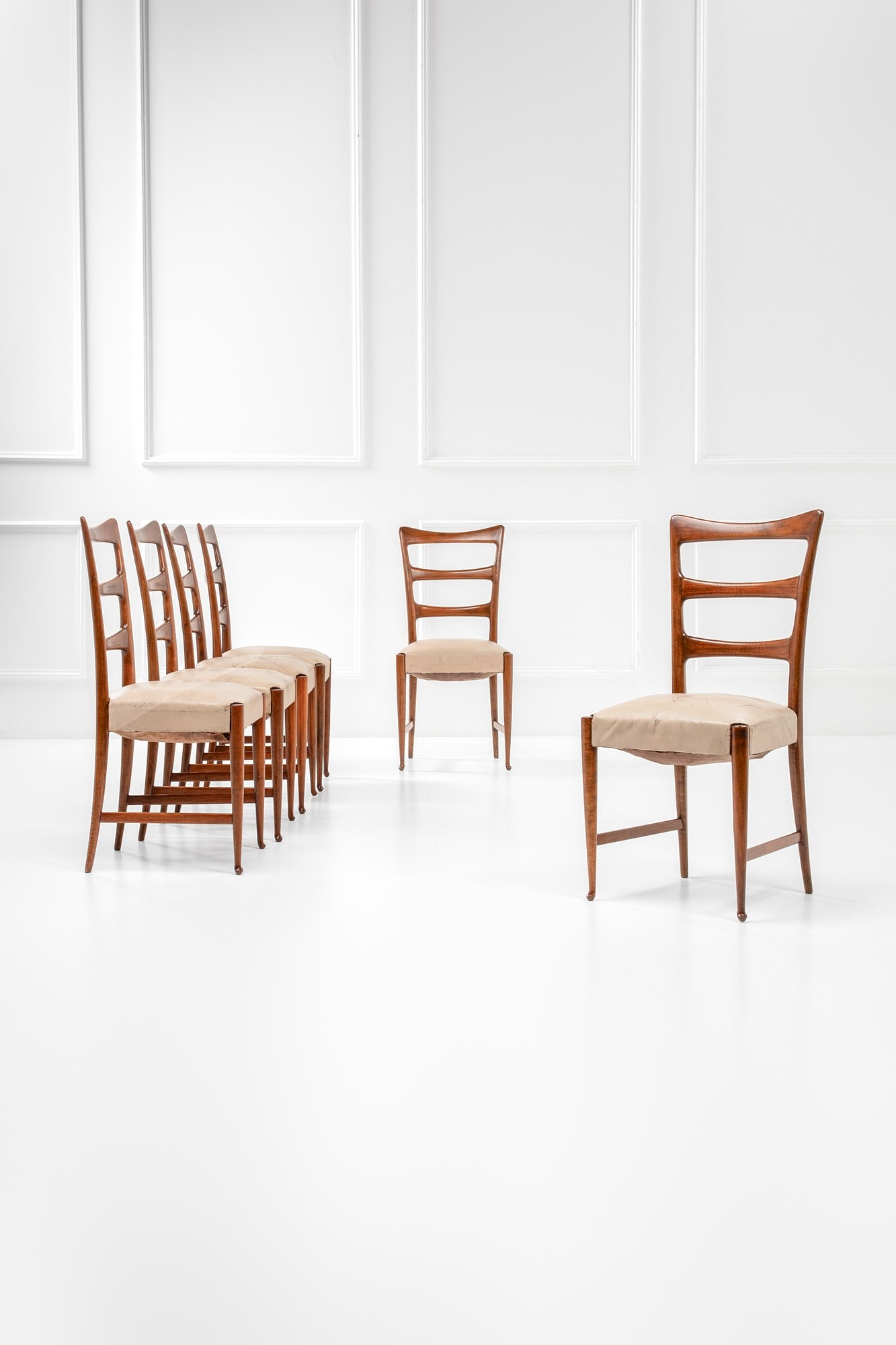 Paolo Buffa. Sei sedie: Sei sedie Legno tinto, similpelle. Esecuzione Marelli & Colico, Cantù, 1950 ca. cm 96x43x15 Literature: R. Aloi, Esempi di arredamento moderno di tutto il mondo, Sedie. Poltrone. Divani, Ulrico Hoepl