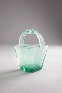 Flavio Poli. Secchiello mod. 6617: Secchiello mod. 6617Vetro soffiato verde nord con manico e superficie corrosa.Seguso Vetri d’Arte, 1937cm 24,5x16,5x16,5Literature: Marc Heiremans, Seguso Vetri d'Arte, Glass Objects from Murano
