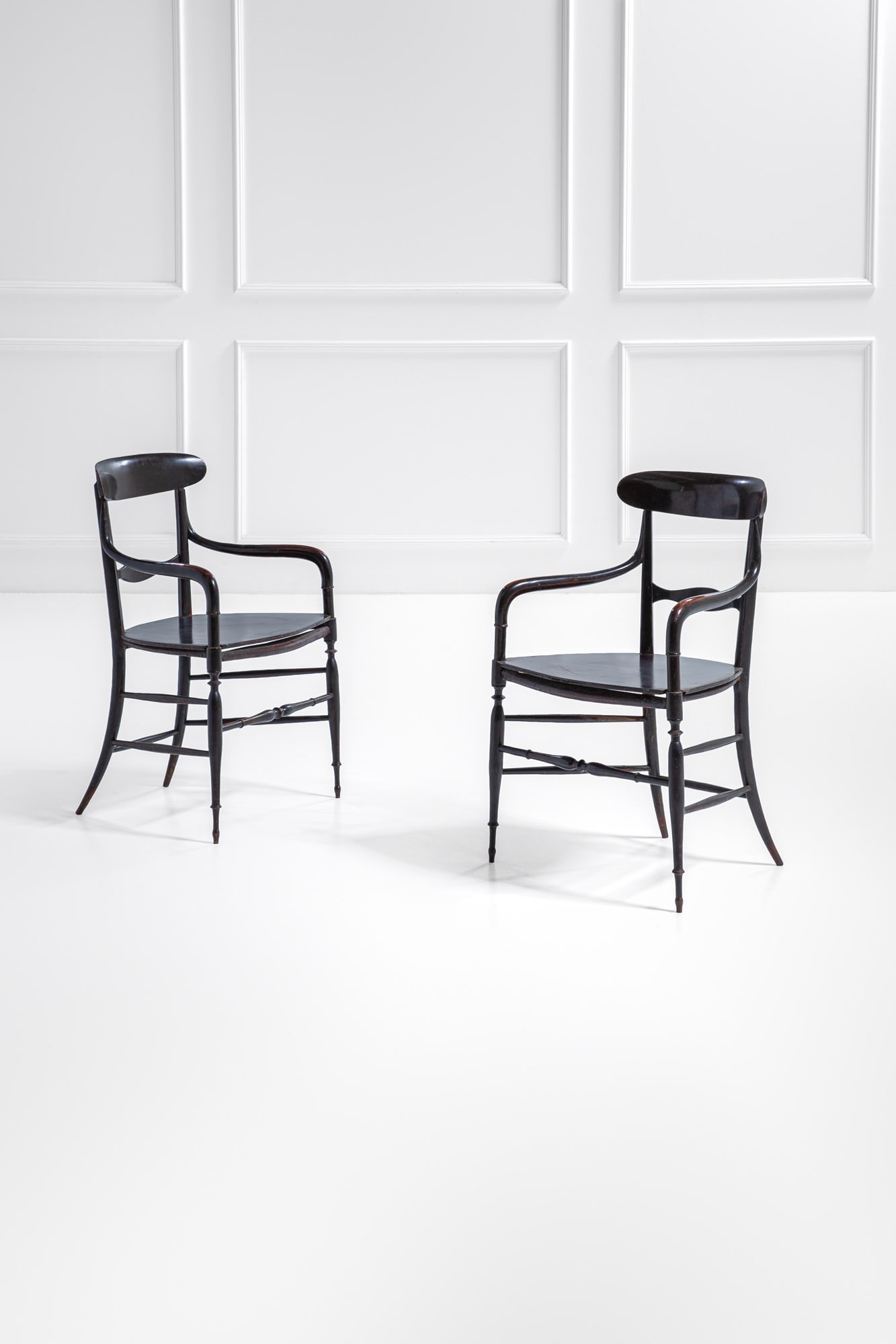 Fratelli Levaggi (attr.). Due poltrone mod. Campanino: Due poltrone mod. Campanino Legno tinto sagomato e curvato. 1950 ca. cm 88x53x48