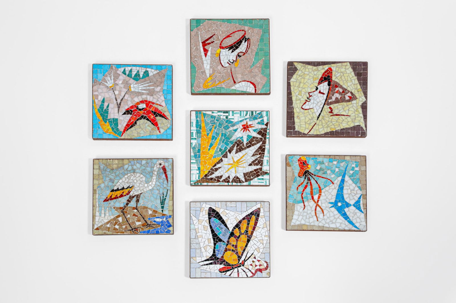 Giordano Righini. Sette piastrelle con mosaico: Sette piastrelle con decori a mosaicoTessere policrome, ferro.1960 ca.cm 3x31x31