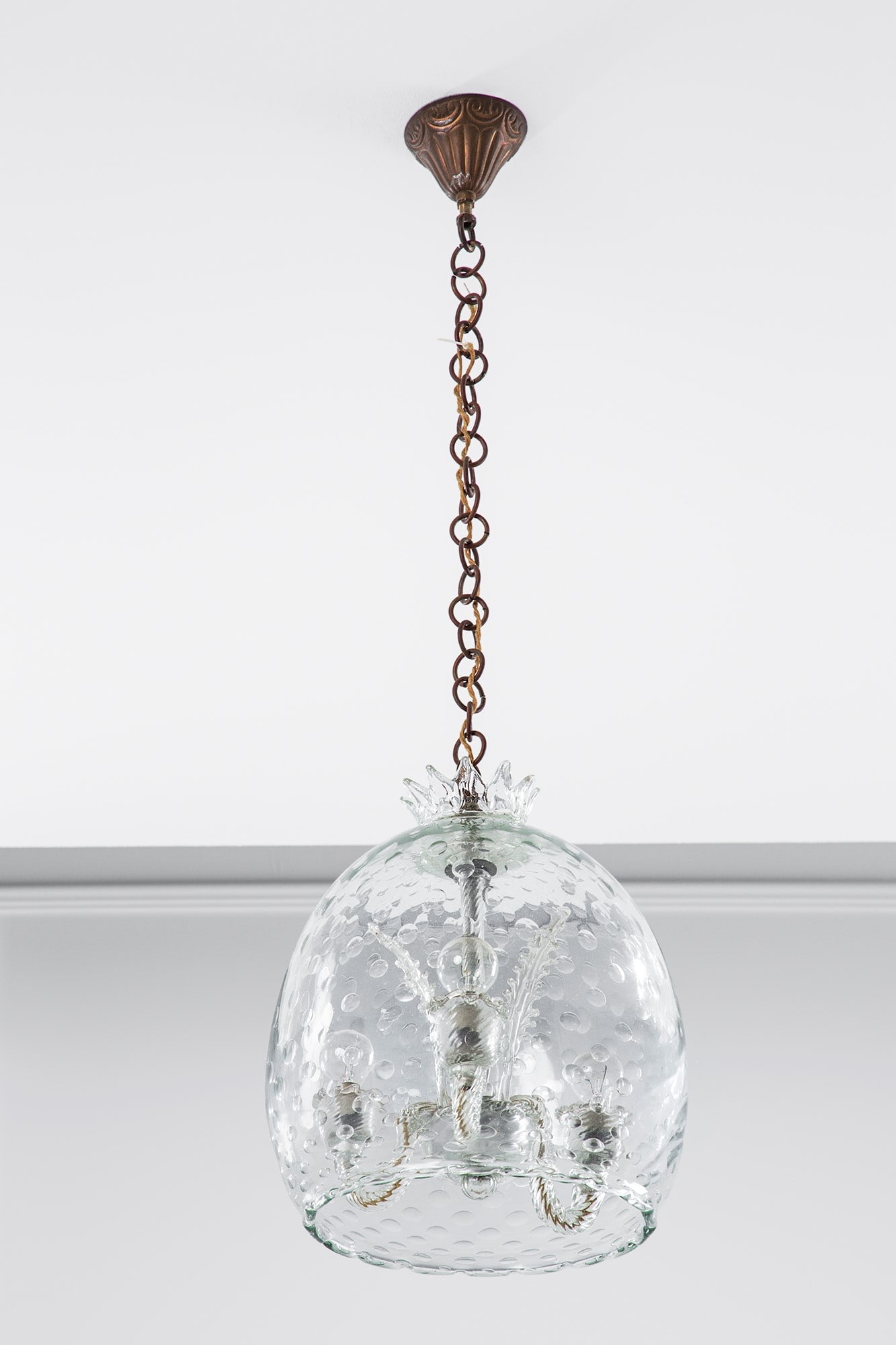 Barovier & Toso (attr.). Lampada a sospensione: Lampada a sospensione Vetro trasparente a bolle, vetro torchon, ottone. 1940 ca. h cm 93, diam. cm 30