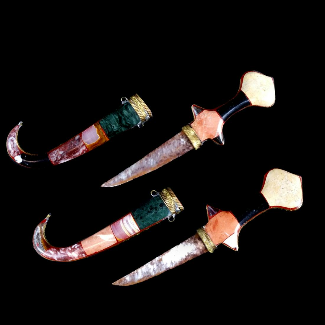 Pair of Middle Eastern Daggers: Pair of Middle Eastern Semi Precious Stones Inlaid Jambiya Daggers / Knives. Each measuring: 9-3/4" L. Condition: Each have corrosion to the blades otherwise good condition. Estimate 200.00 - 300.00 D