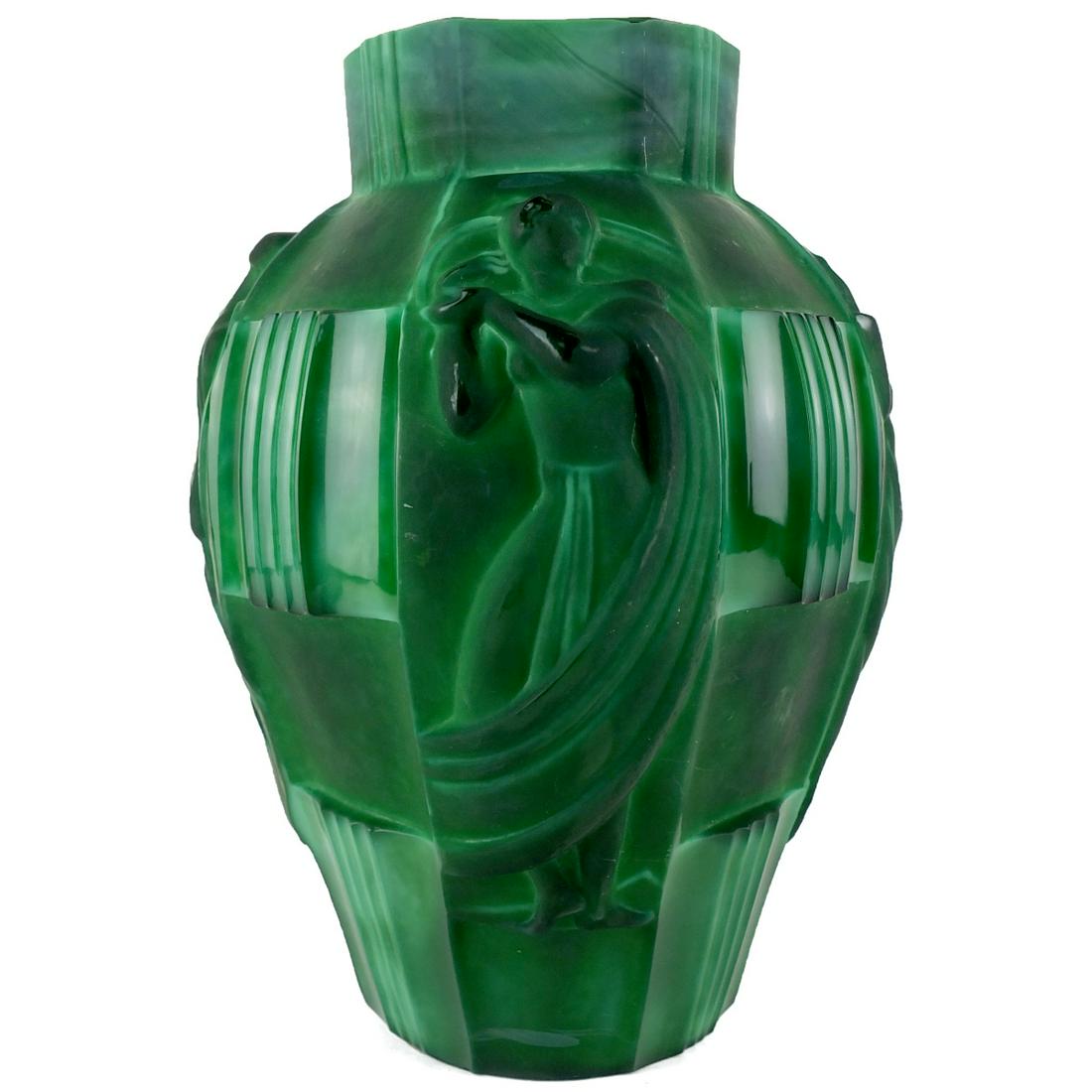 Attrib: Curt Schlevogt Malachite Glass Vase: Attributed to Curt Schlevogt Art Deco "Ingrid" Malachite Glass Vase with Raised Neoclassical Style Figures Encircling the Outer Surface. Measures 9-1/2" x 6-1/2". Condition: Good condition. Estimate $