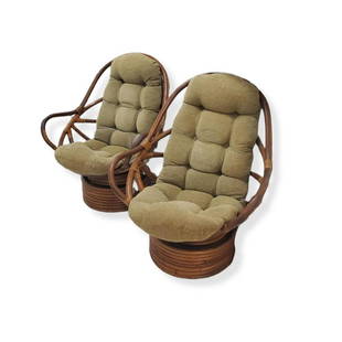 Mnnr of Paul Frankl Chairs: In The Manner of Paul Frankl, Pair of Mid Century Rattan High Back Swivel Chair with Upholstered Seat Cushions. Measures 39" x 32", seat height 18". Condition: Rubbing and scuffs to the frame,