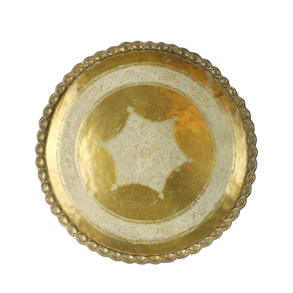Middle Eastern Brass Tray: Large Vintage Middle Eastern Etched Brass Tray. Intricate pattern on the surface, Measures 36-1/2". Condition: Spotting, rubbing otherwise good condition. Estimate 40.00 - 60.00 Domestic shipping Thir