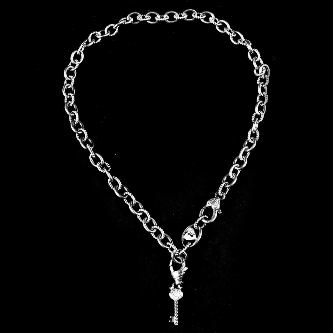 Judith Ripka Sterling Silver Necklace: Vintage Judith Ripka Sterling Silver Necklace with CZ Inset Key Pendant. Stamped. Measures 18". Approx. weight: 1.54 troy ounces. Condition: Good condition. Estimate 60.00 - 100.00 Domestic shipping T