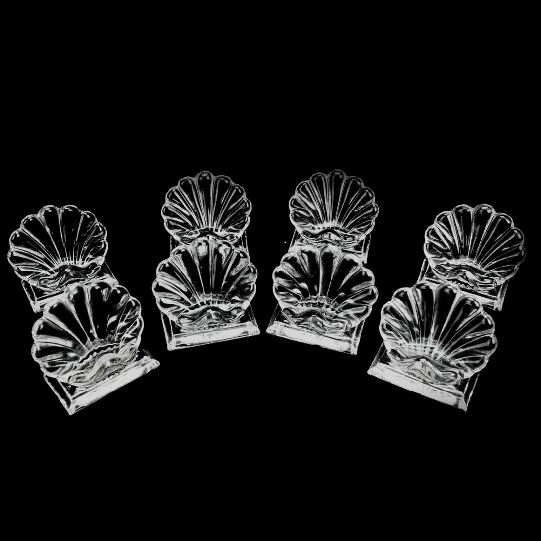 Set of Eight Baccarat Crystal Card Holders. Signed. Measures 2-1/4" x 2-1/2" x 1-1/2". Condition: (1 of 4)