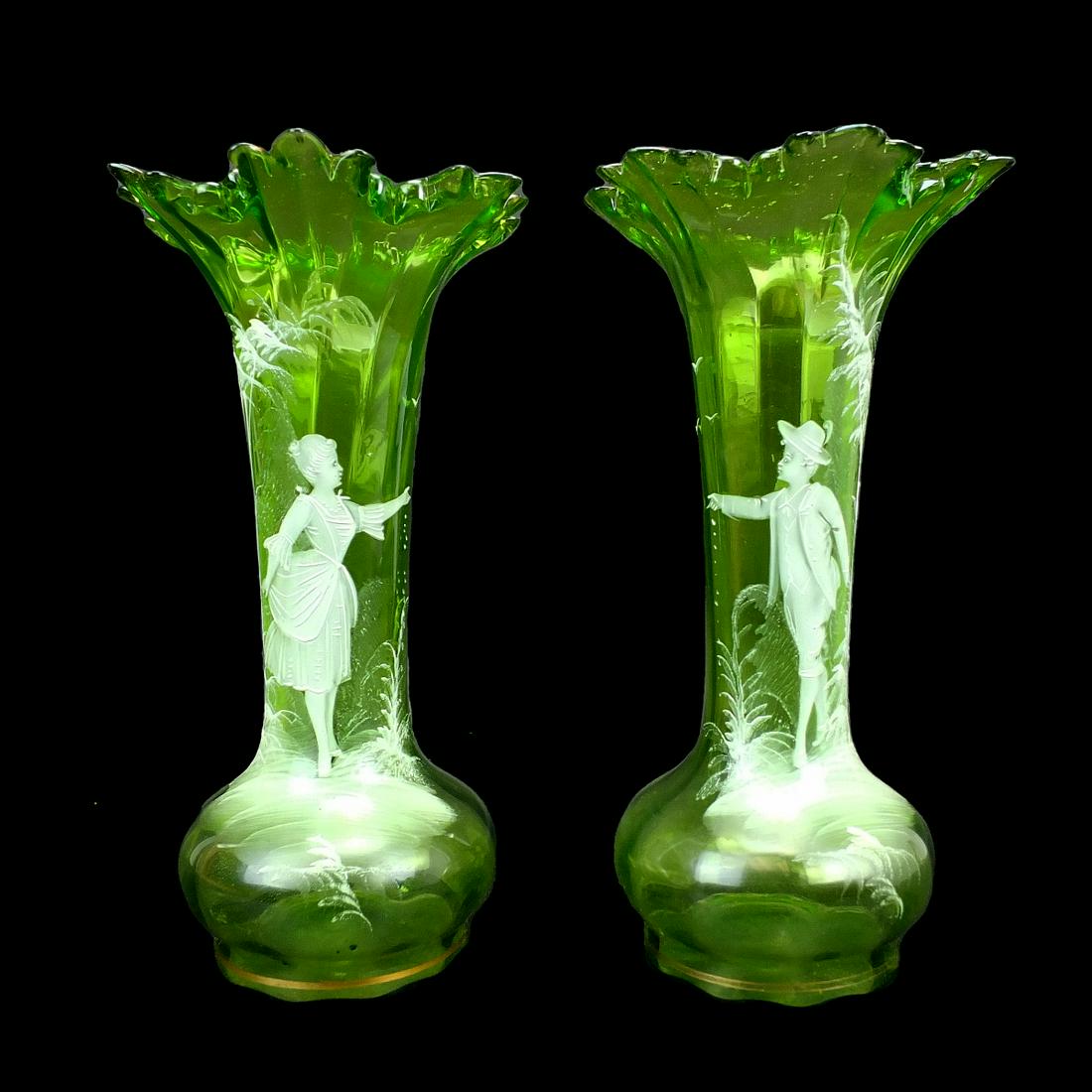 Pair of Antique Mary Gregory Vases: Pair of Antique Mary Gregory Green Glass Vases with Victorian Figural Scenes. Pontil mark on the bases. Measures 10" x 5-1/4" diameter top. Condition: Good condition. Estimate 100.00 - 200.00 Domestic