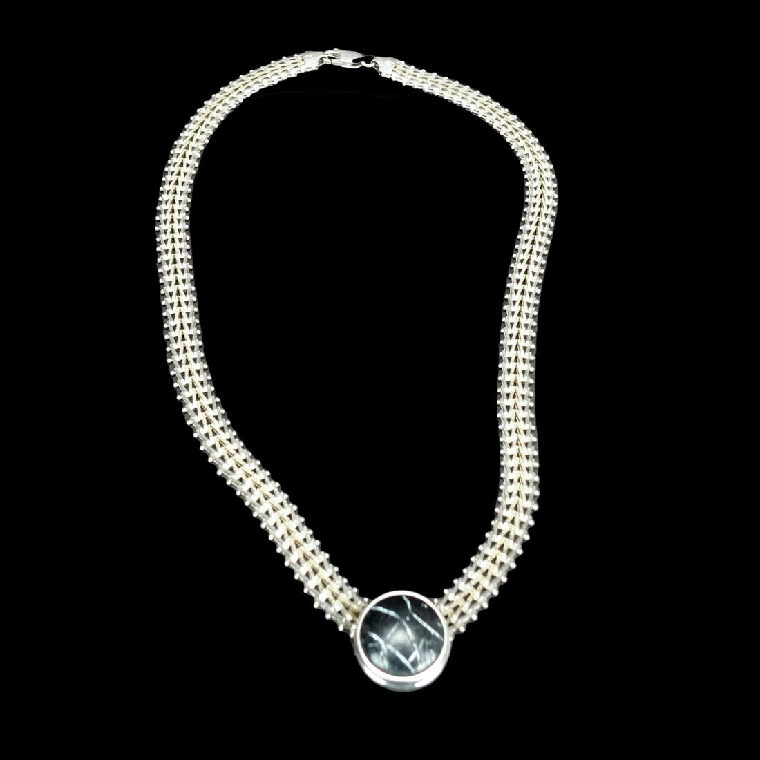 Vintage Milor Sterling Necklace w/ Pendant: Vintage Milor Italian Two-Tone Sterling Silver Necklace with Non-Silver Pendant. Stamped 925, made in Italy. Necklace measures 18" L. Condition: Good condition. Estimate 100.00 - 150.00 Domestic shipp