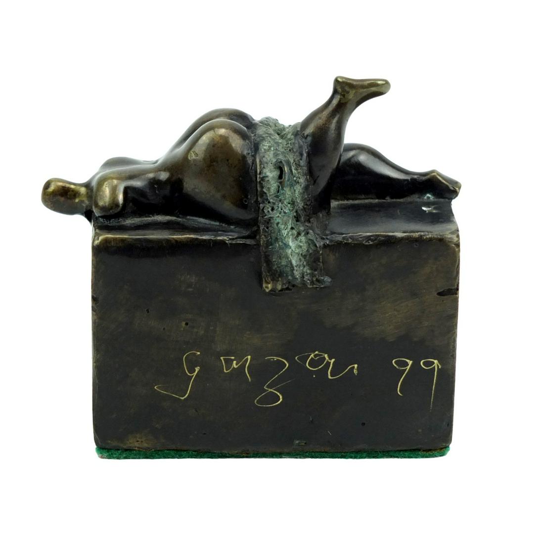 Emiro Garzon Correa (20th/21st c.): Emiro Garzon Correa, Colombian (20th/21st century) "Recumbent Nude" Patinated Bronze Sculpture, Signed and Dated 1999. Measures 3-1/4" x 3-1/2" x 2". Condition: Good condition. Estimate 100 - 500 Dome