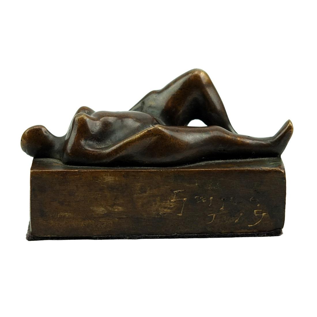 Emiro Garzon Correa (20th/21st c.): Emiro Garzon Correa, Colombian (20th/21st century) "Recumbent Nude Facing Up" Patinated Bronze Sculpture, Signed and Dated 1999. Measures 2" x 3-1/4" x 1-1/2". Condition: Good condition. Estimate 100.