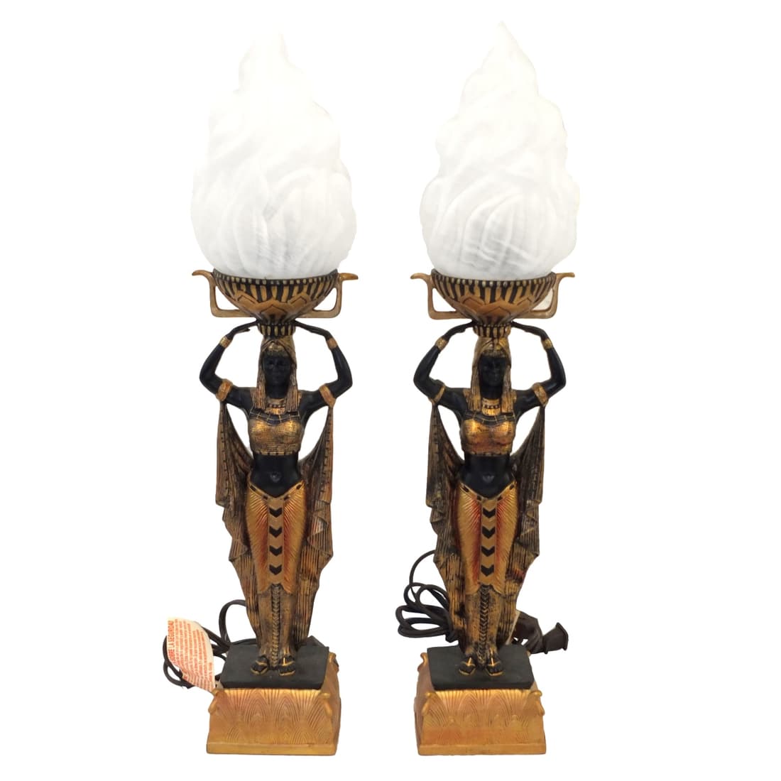 Pair of Egyptian Figural Lamps: Pair of Egyptian Figural Lamps with Frosted Glass Shades. Measures 22" x 4-1/4" x 5". Condition: Good condition. Estimate 100.00 - 150.00 Domestic shipping Third party