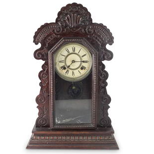 Antique Ansonia Mantle Clock: Antique Ansonia Carved Wood Gingerbread Mantle Clock. Marked: manufactured by the Ansonia clock co., New York, the United States of America. Key and pendulum to accompany the lot. Overall measures 22-