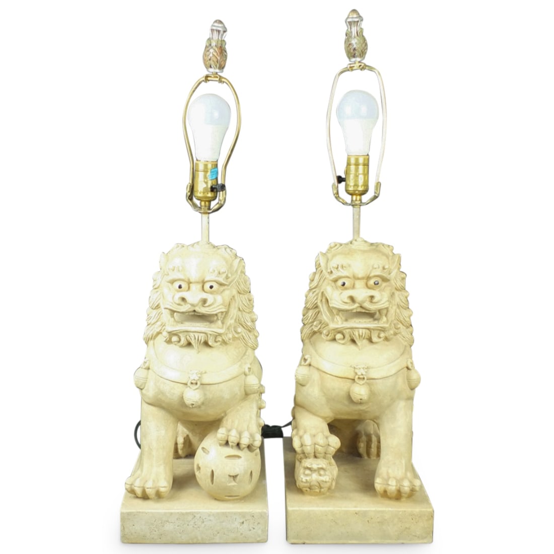 Pair of Modern Chinese Food Dog Lamps: Pair of Modern Chinese Plaster Food Dog Lamps. Overall measures 28-1/2" x 7-3/4" x 13". Foo dog height: 16-1/4". Condition: One lamp has a chip the one corner on the base and a chip to the "hair" of o