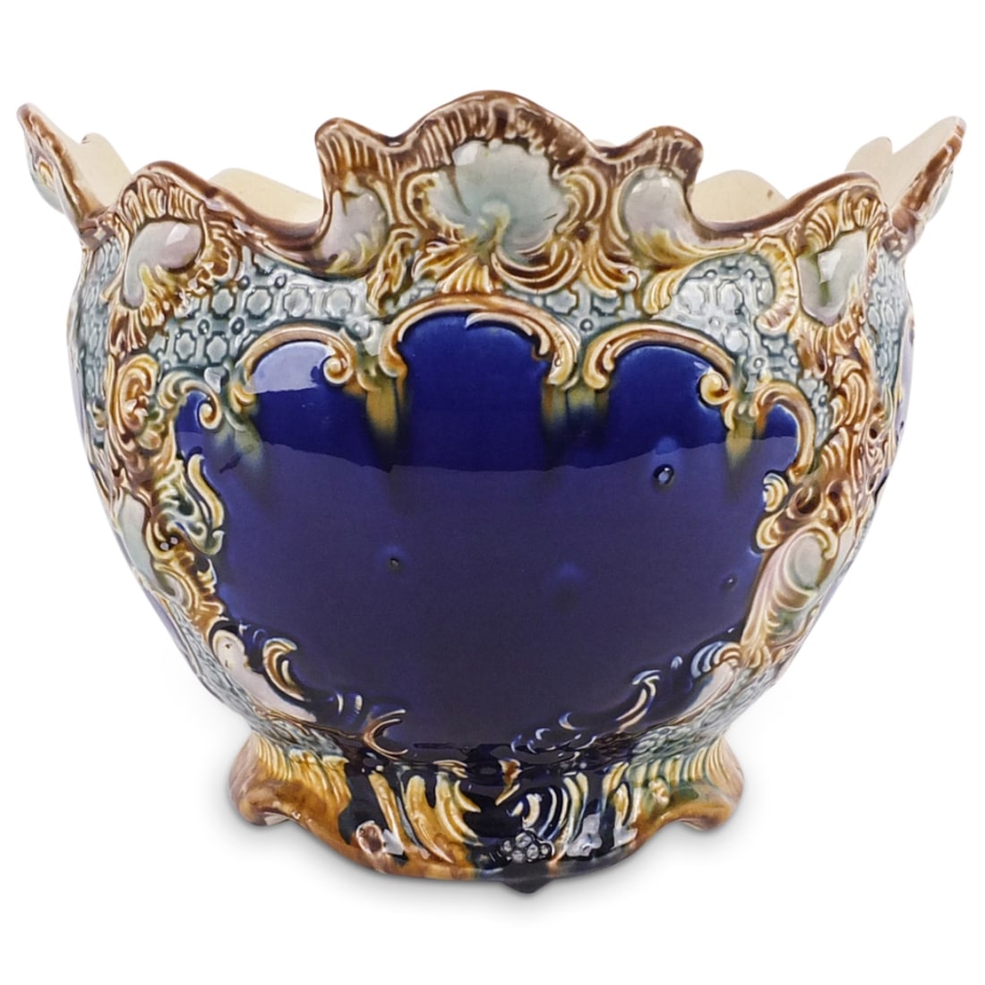 Antique Majolica Glaze Pottery Planter: Antique Majolica Glaze Pottery Planter / Jardinière. Has a number mark written in blue on the base. Measures 8-3/4" x 11-3/4". Condition: Crazing throughout the surface. Otherwise good condition. Est