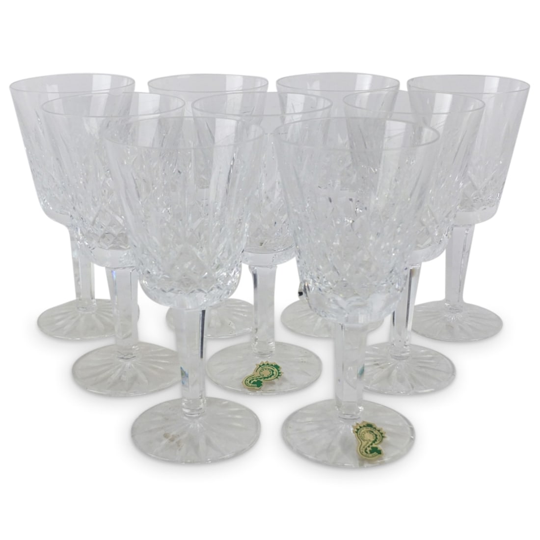 Nine Waterford Cut Crystal White Wine Glasses: Set of Nine Waterford Cut Crystal White Wine Glasses. Signed on the base. A few still have the original label. Measures 5-3/4" x 2-5/8". Condition: Two glasses have chips to the rim. Estimate 20 - 150