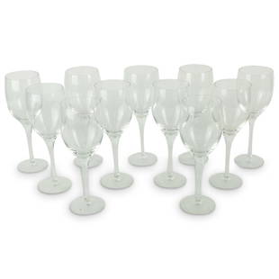 Orrefors "Illusion" Crystal Wine Glasses: Set of Eleven Orrefors "Illusion" Crystal Wine Glasses. Signed. Measures 7-1/4", 2-3/8" diam. Condition: Good condition. Estimate 100 - 300 Domestic shipping Third party