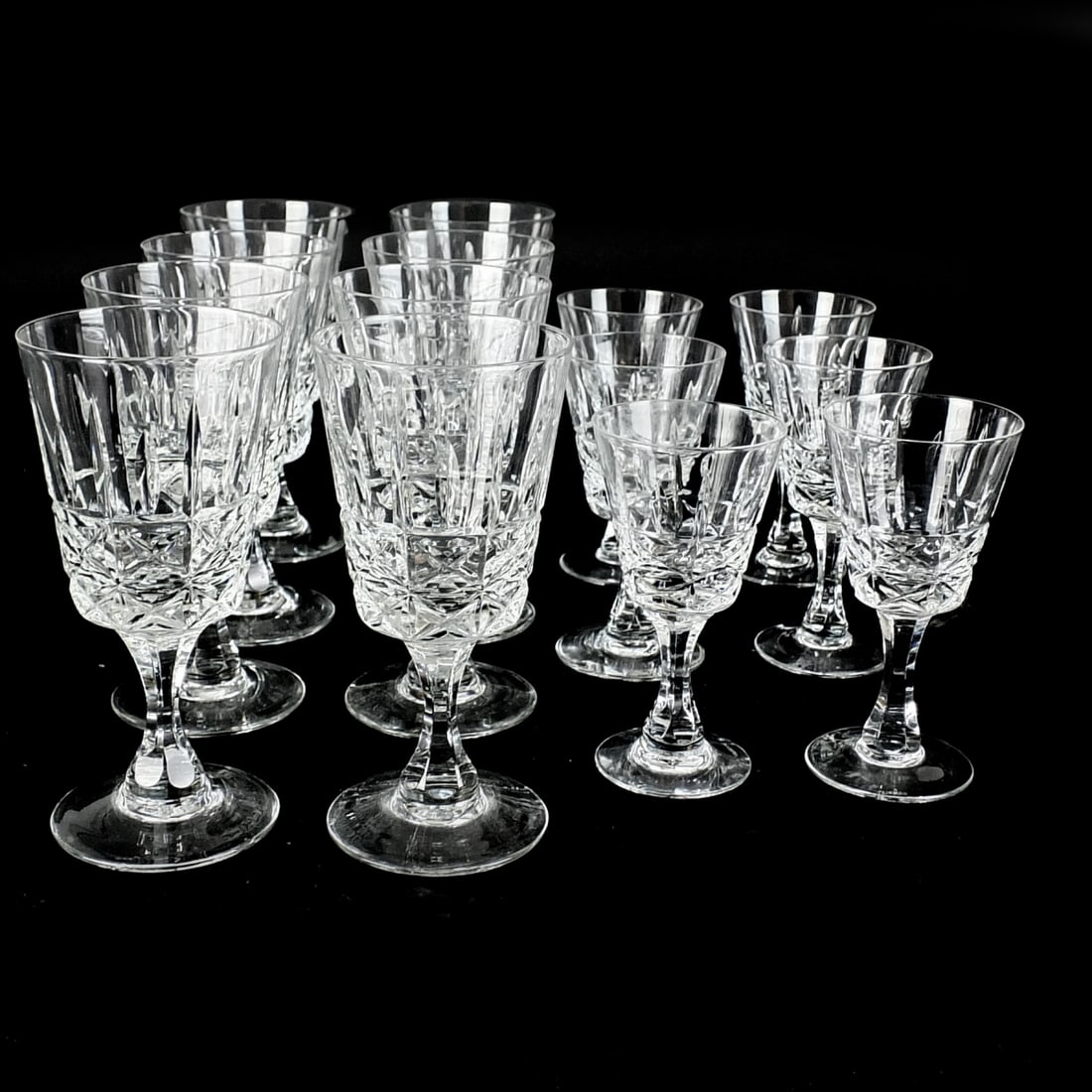 Royal Brierley Stemware: Set of Fourteen Royal Brierley "Marlborough" Cut Crystal Stemware. Includes (8) water goblets measuring 6-7/8", (6) wine glasses measuring 5-1/2". Appropriately marked. Condition: One goblet and one w