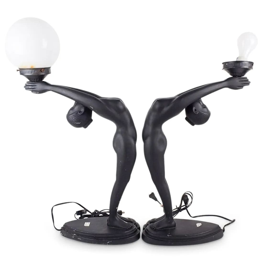 Pair of Art Deco Nude Lamps: Pair of Art Deco Nude Figural lamps. Underwrites label attached to the surface. Measures: 20" x 5" x 13-1/2". Condition: Both lamps have scuffs and scratches to the surface. One is missing a shade. Es