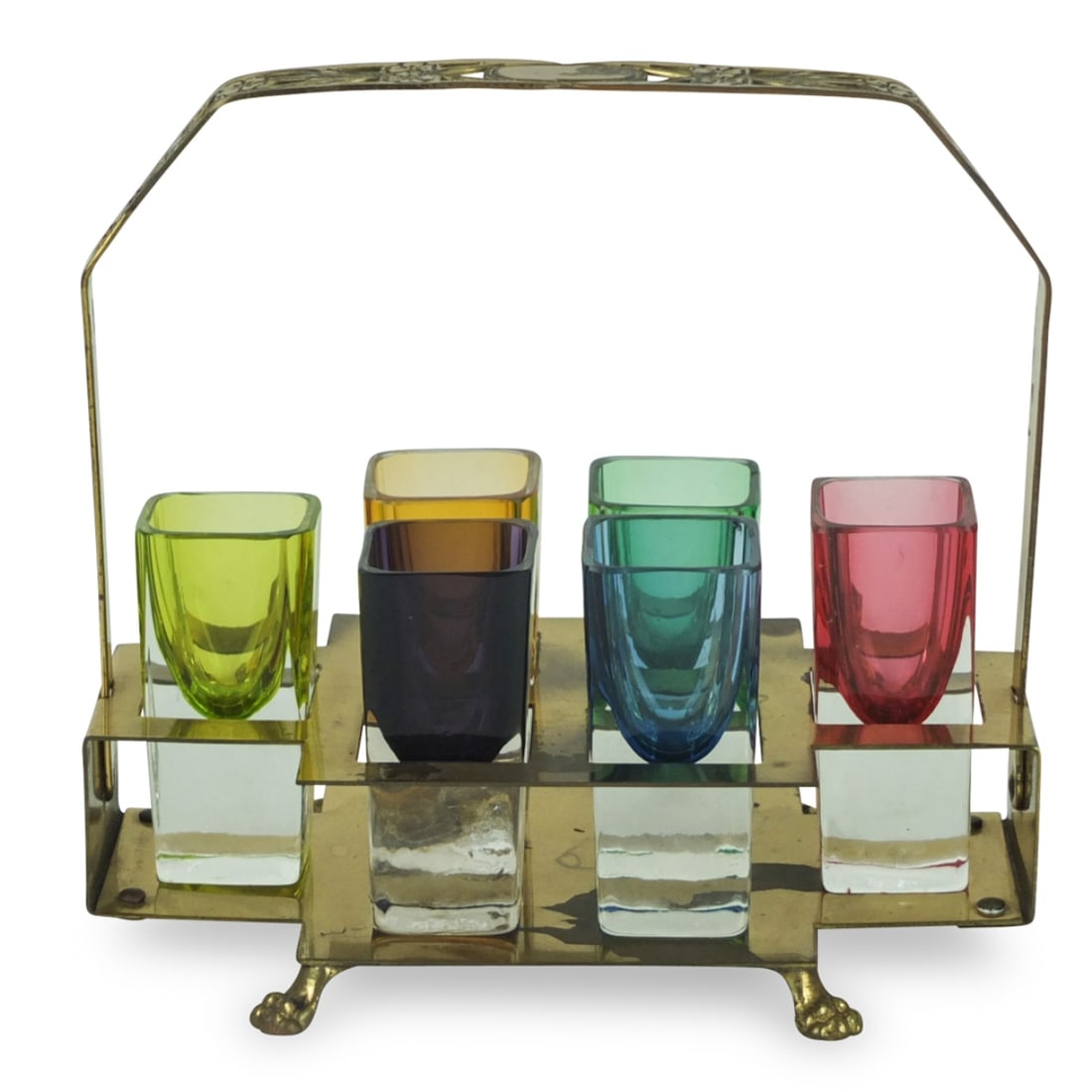 Vintage Shot Glasses in Empire Style Holder: Vintage Multi Color Shot Glasses in Empire Style Brass Holder Faber Ware. includes six glasses measuring 2-3/4" x 1-1/4". Condition: One glass is in as is condition. Others are in good condition. Stan