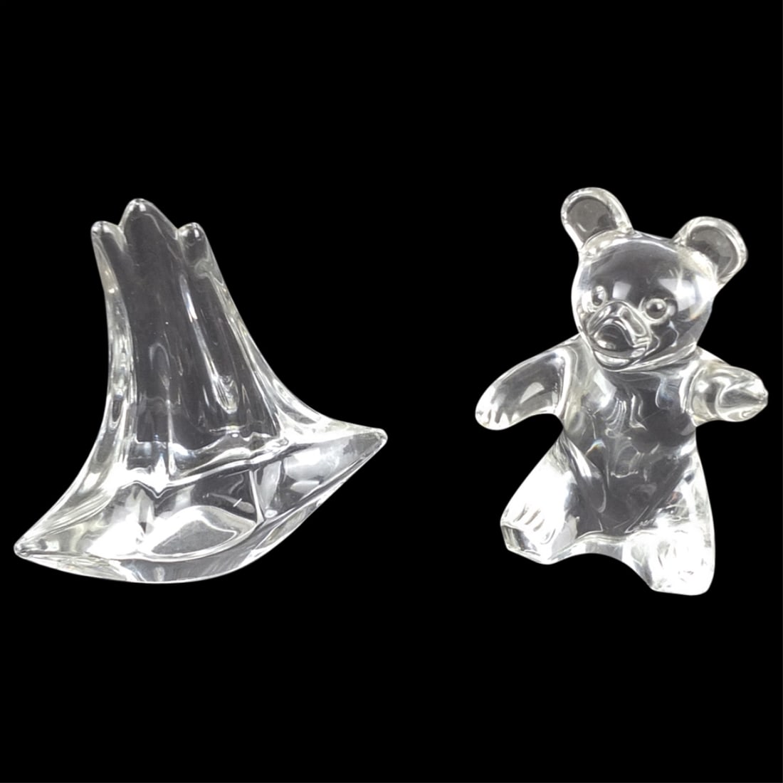 Grouping of Daum Glass Paperweights: Grouping of Two Daum France Glass Paperweights. Includes a bear and a sailboat. Both are signed. Bear measures 4" x 3". Sailboat measures 4-1/8". Condition: Both are in good condition. Estimate 100 -