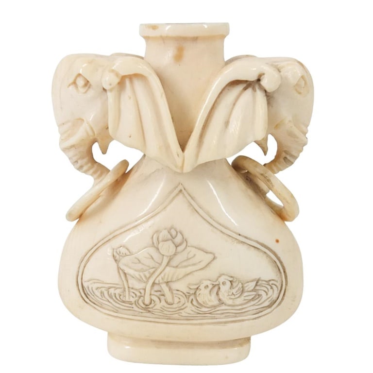 Antique Chinese Carved Snuff Bottle: Antique Chinese Carved Snuff Bottle with Elephant Head Ring Handles. Signed on the base. Measures 2-5/8" x 1-7/8". Please note; this lot contains material which may be subject to state or import/expor