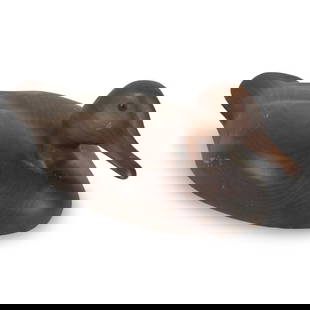 Vintage Wooden Duck Decoy: Vintage Hand Carved Wooden Duck Decoy. Illegible stamped on the bottom side. Measures: 5-1/4" x 6-1/2" x 14-1/2". Condition: Has some scratches and scuffs to the surface. Estimate 50 - 150 Domestic sh