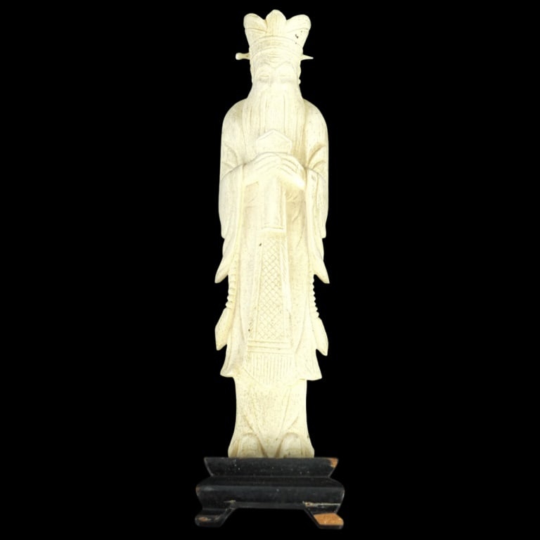 Antique Chinese Carved Figurine: Antique Chinese Carved Immortal Figurine Presented on a wooden base. Measures 8" x 2-1/8". Please note; this lot contains material which may be subject to state or import/export restrictions. Conditio