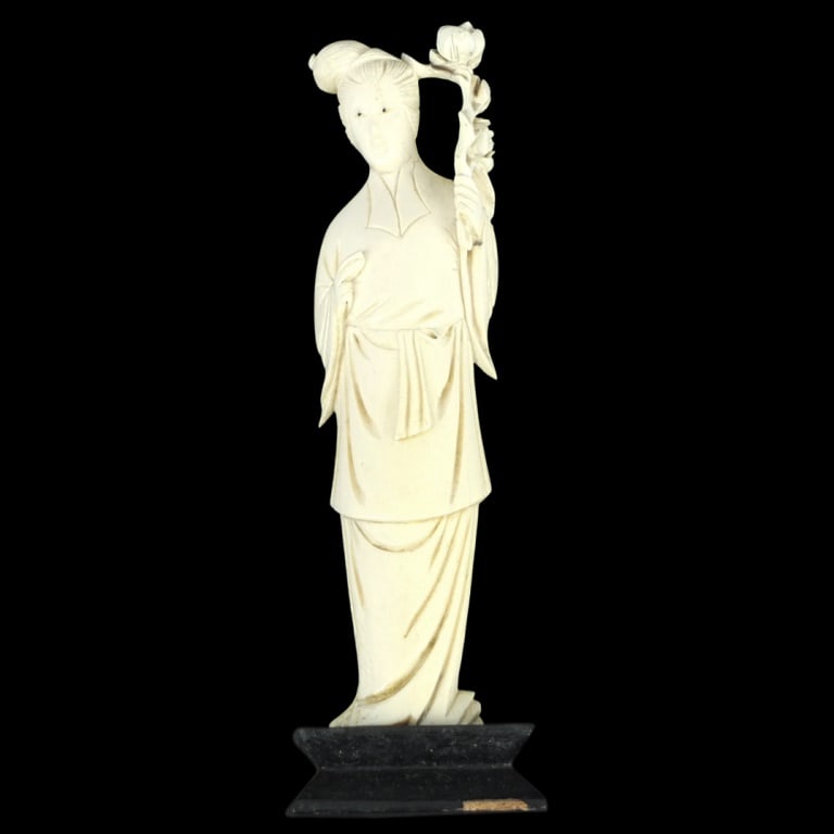 Antique Chinese Carved Figurine: Antique Chinese Carved Guanyin Figurine Presented on a Wooden Base. Overall measures 6-7/8" x 2". Please note; this lot contains material which may be subject to state or import/export restrictions. C