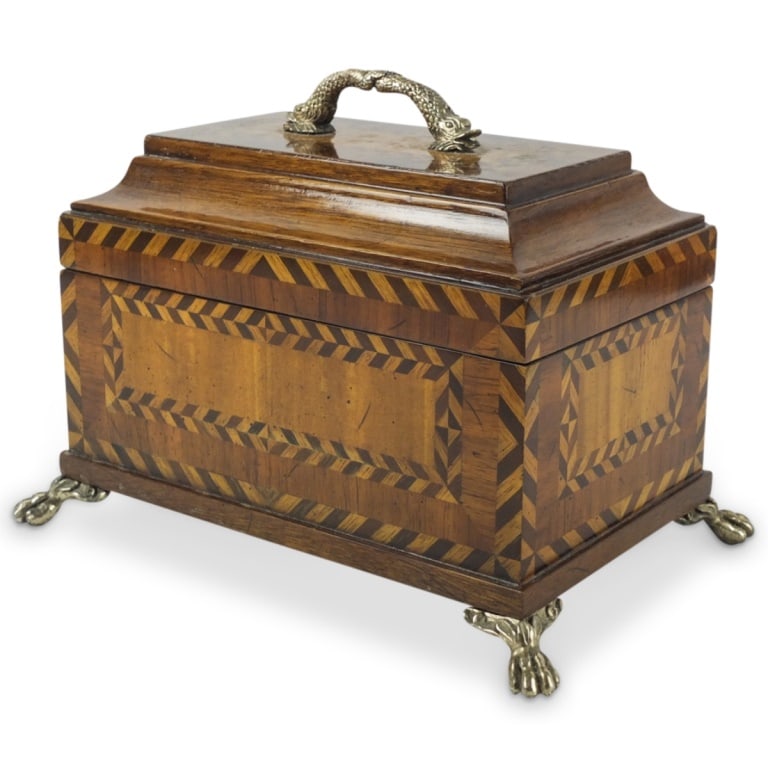Mid Century Empire Style Dresser Box: Mid Century Empire Style Marquetry Inlaid Dresser Box with Paw Feet and Dolphin Handle. Measures 8-1/2" x 11-3/8" x 7-1/2". Condition: Good condition. Estimate 50 - 150 Domestic shipping Third party