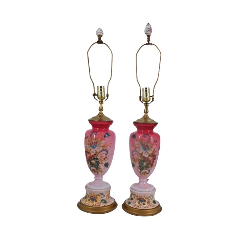 Pair Victorian Bristol Glass Urns as Lamps: Pair Victorian Bristol Glass Urns as Lamps. Pinl opaline glass with hand painted floral motif on painted bases. Harps with porcelain finials accompany the lot. Unsigned. Measures 21-1/2" x 7" overall