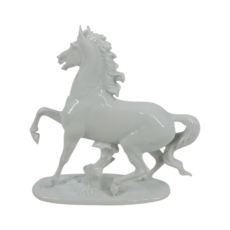 Rosenthal White Porcelain Horse Figurine: Rosenthal White Porcelain Horse Figurine. Marked with green Rosenthal backstamp and impressed Prof. T Karner 1136. Measures 6-3/4" H. Condition: Good condition with no chips, cracks or repairs. Estima