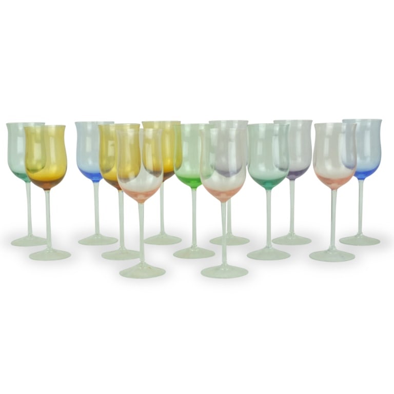 Set of Venetian style Stemware: Set of Thirteen Venetian style multi color stemware. Measures 9-1/8" x 3". Condition: A few have very small nicks to the rim otherwise good condition. Estimate 50.00 - 250.00 Domestic shipping Third p