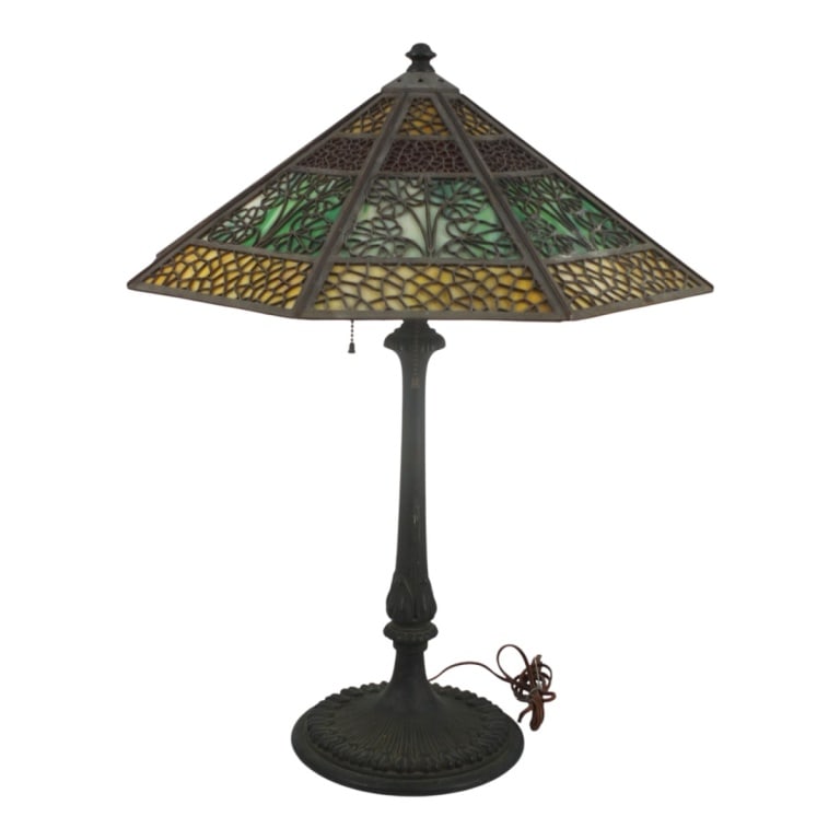 Bradley & Hubbard Arts & Crafts Slag Glass Lamp: Bradley & Hubbard Arts & Crafts Slag Glass Lamp. The shade with a leaves motif. On bronze base stamped #276. No visible signature. Measures 25" H overall, the shade measures 8" H x 19-3/4" Condition: