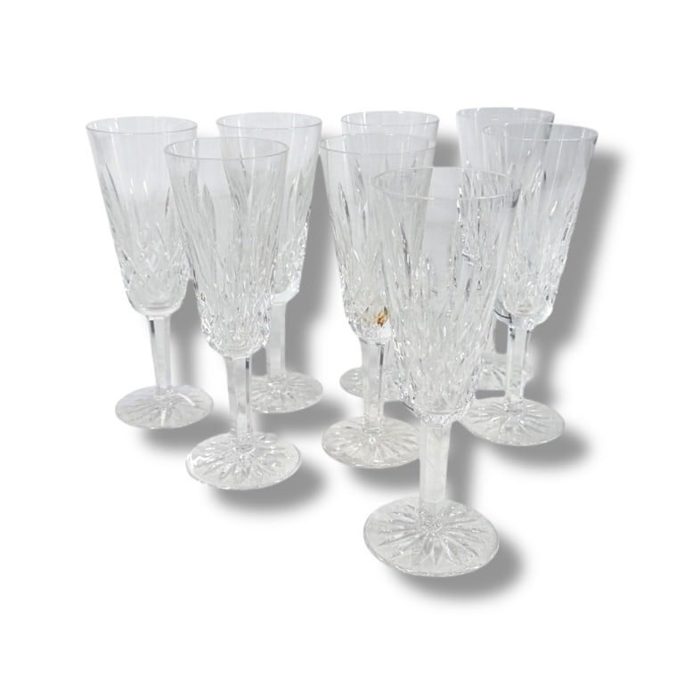 8 Waterford "Lismore" Champagne Flutes: 8 Waterford "Lismore" Champagne Flutes. Signed. Measures 7-1/4" H. Condition: No chips, no cracks, in good condition consistent with age and use. Estimate 200 - 400 Domestic shipping Third Party