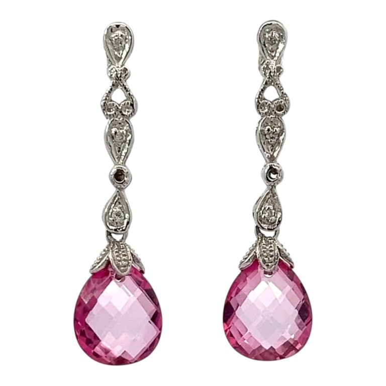 Pair of 14K White Gold & Pink Topaz Earrings: Pair of 14 karat white gold 5.00 carat briolette pink topaz drop earrings. Measures 1-1/2" drop. Approx. weight: 4.9 grams. Condition: Good condition. Estimate 400 - 600 Domestic shipping Third party