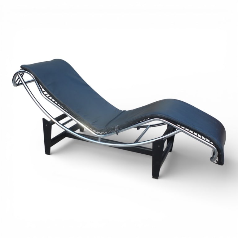 Attrib: Le Corbusier Chaise Lounge Chair: Attributed To: Le Corbusier chrome and leather LC4 chaise lounge chair. Chair measures 31" x 21-1/2" x 61". Base measures 12" x 22-1/2" x 36-1/2". Condition: Missing the pillow, needs a routine cleani