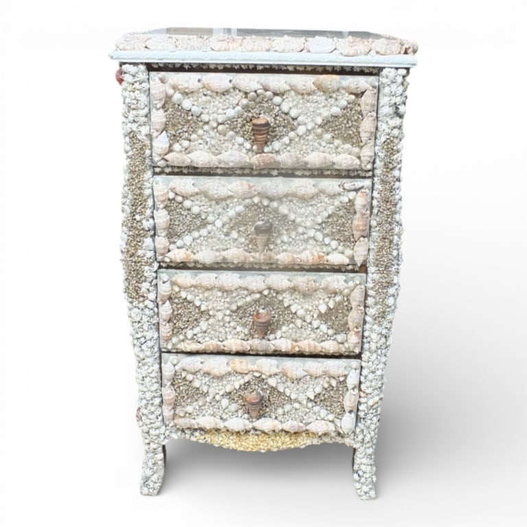 A Contemporary Shell-Encrusted Chest of Drawers: A Contemporary Shell-Encrusted Chest of Drawers. Marble top, 4 drawers, decorated throughout. Measures 37" H x 21" W x 17-1/2" D. Condition: Good condition. Estimate 800 - 1200 Domestic shipping Third