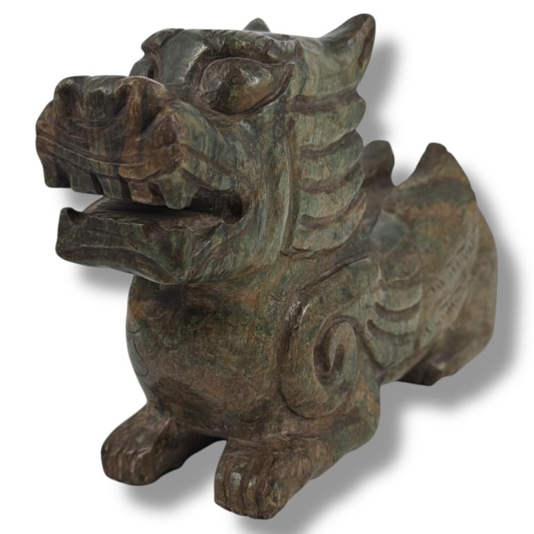 Large Chinese Carved Spinach Jade Qilin Figure: Large Chinese Carved Mottled Spinach Jade Qilin Figure. Unsigned. Measures 5-3/4" H x 11" L x 2-3/4" W. Condition: Good condition. Estimate 300 - 500 Domestic shipping Third Party