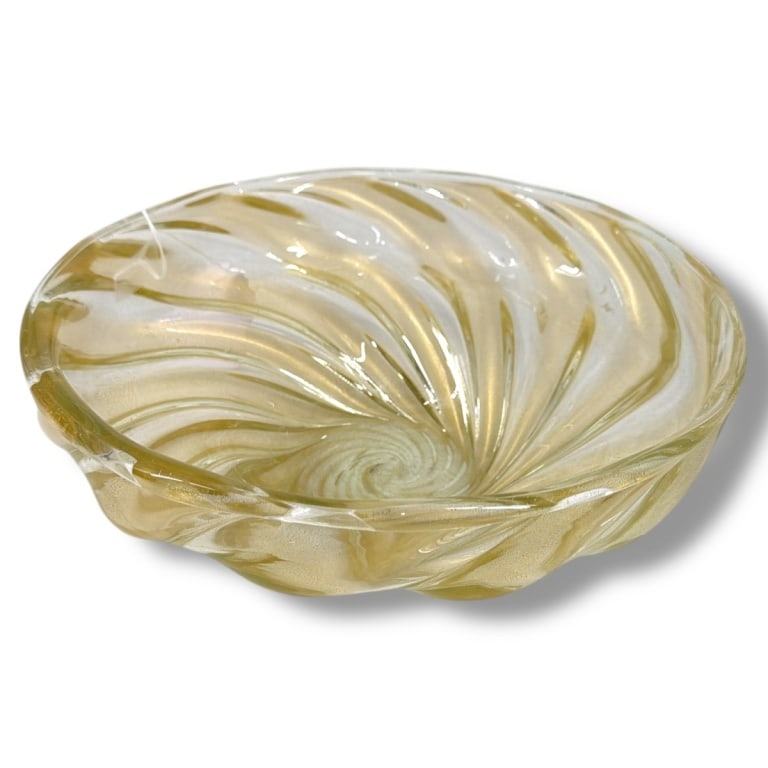 Mid Century Murano Glass Swirl Centerpiece Bowl: Mid Century Murano Art Glass Swirl Centerpiece Bowl. Clear glass with internal gold flecks with a cut and polished pontil. Unsigned. Measures 4-1/4" H x 11" W. Condition: Good condition. Estimate 100
