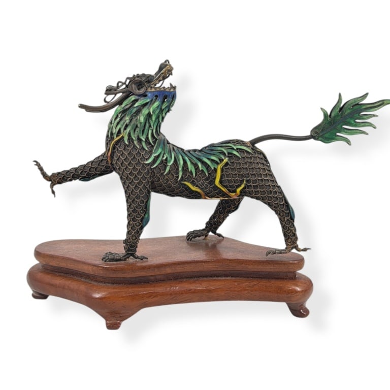 Vintage Chinese Silver & Enamel Qilin Figure: Vintage Chinese Silver & Enamel Qilin Figure on Wood Base. Unmarked. Measures 5-1/2" H x 8" L overall. Condition: Losses to eyes or in good condition consistent with age. Estimate 100 - 200 Domestic s