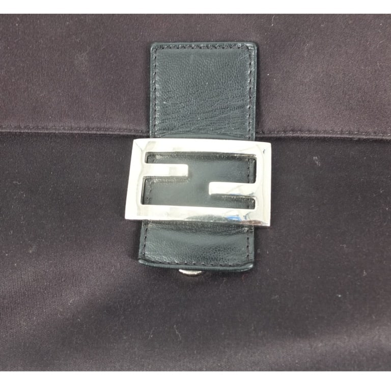 Fendi Black Canvas "Mamma Baguette" Bag: Fendi Black Canvas "Mamma Baguette" Bag. Labeled appropriately. Measures 7-3/4" x 11-1/2" x 4-3/4". Condition: Light wear or in good pre-owned condition consistent with use. Estimate 100 - 300