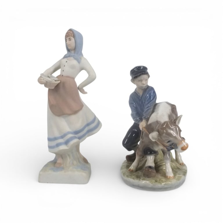 Royal Copenhagen Figurine #772 "Boy with Calf" +1: Royal Copenhagen Figurine #772 "Boy with Calf". Marked appropriately, 6-3/4". Also included a Spanish porcelain similar to NAO "Fish Seller", signed, 9". Condition: Tiny chip to calf's ear or in good