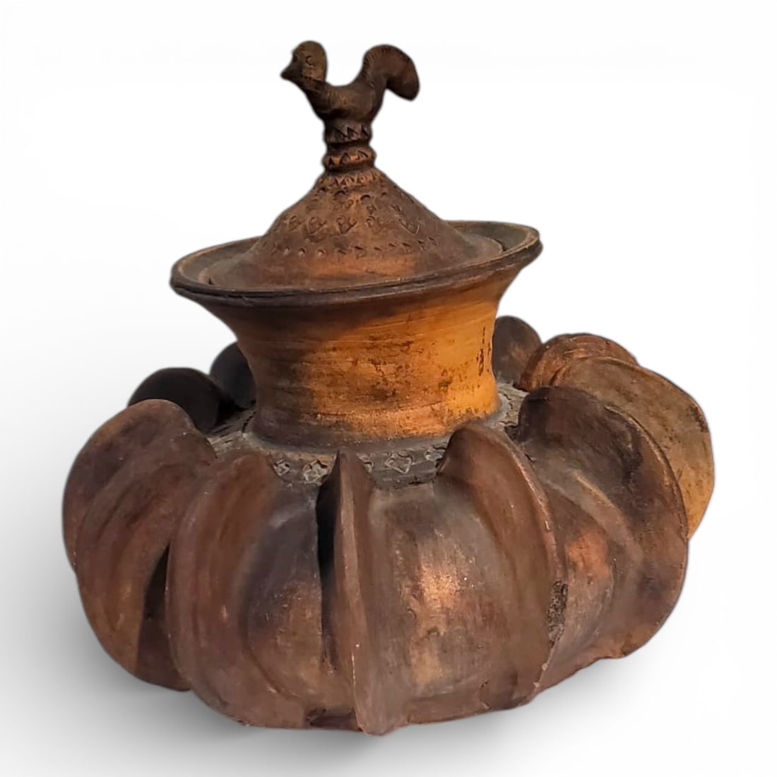 Vintage Mexican Folk Art Pottery Vessel: Vintage Mexican Folk Art Pottery Vessel. A terracotta lidded pot featuring a pumpkin shape and a bird finial. Unsigned. Measures 18" x 18". Condition: Some losses to ribs of body or in good condition